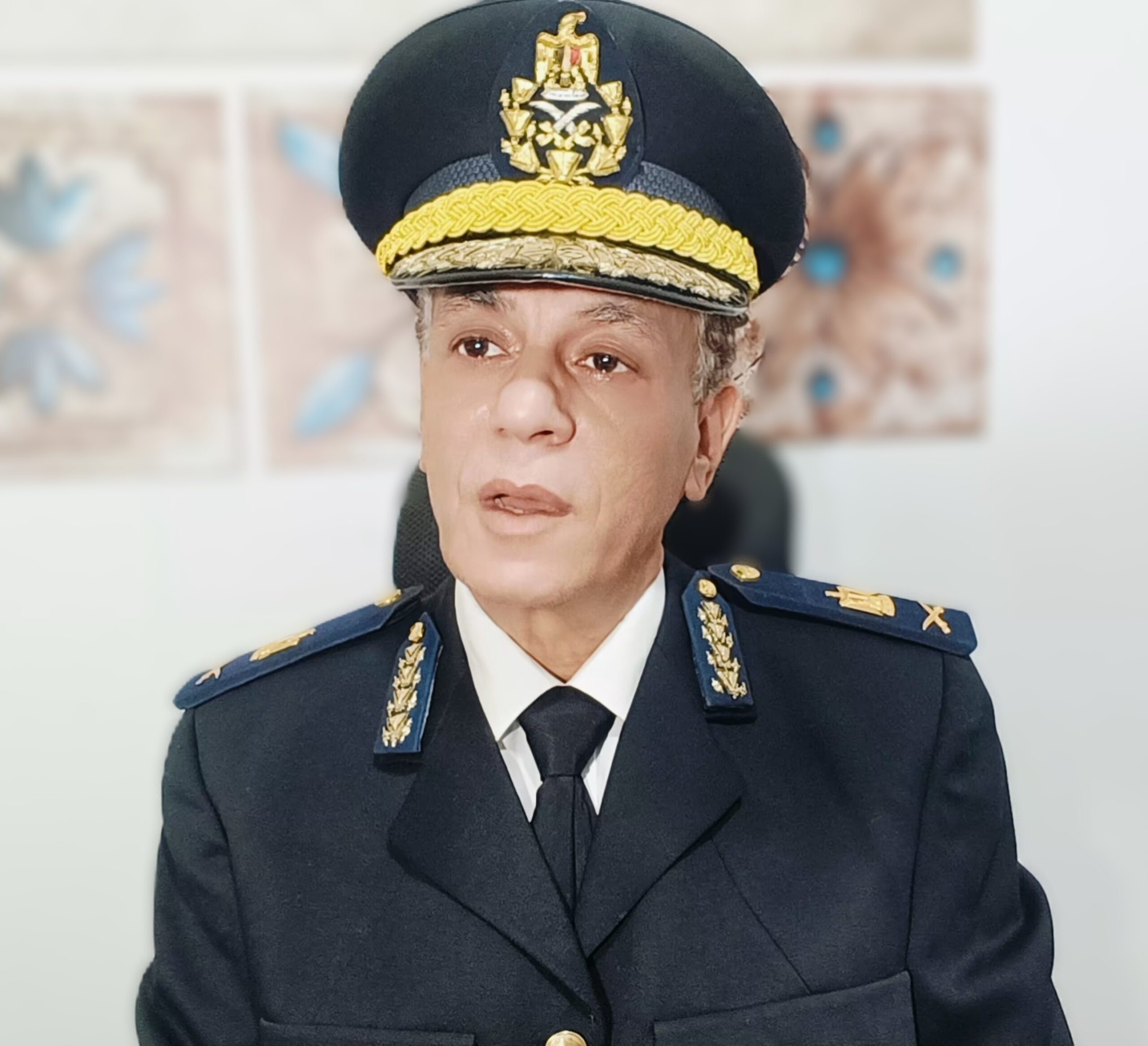 Officer in formal military uniform.