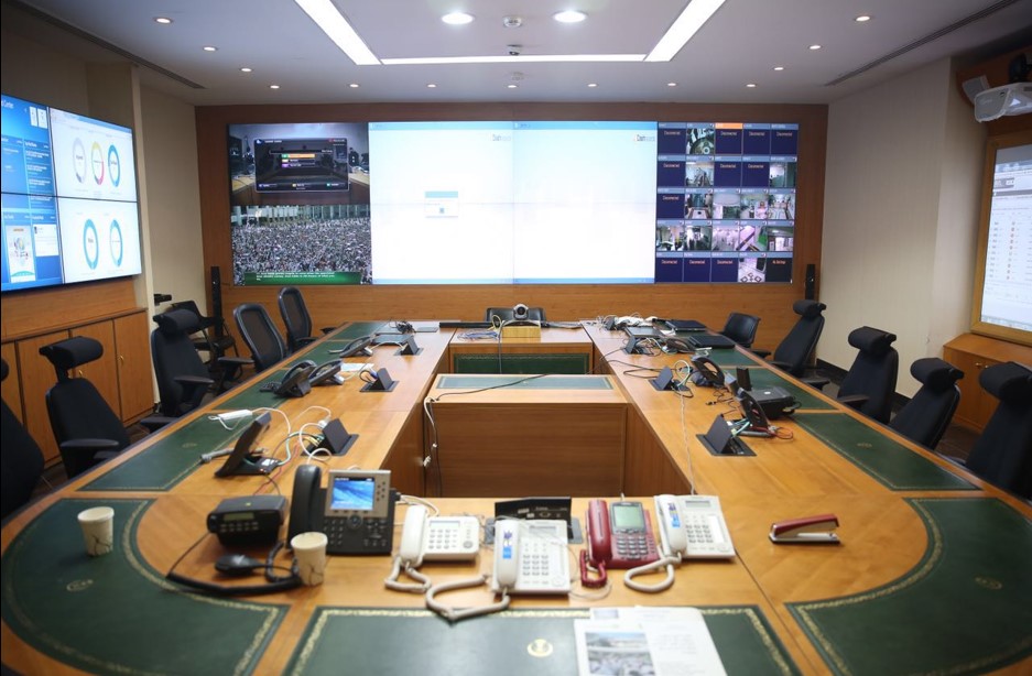 Professional VIP protection team conducting advance planning in high-risk environments